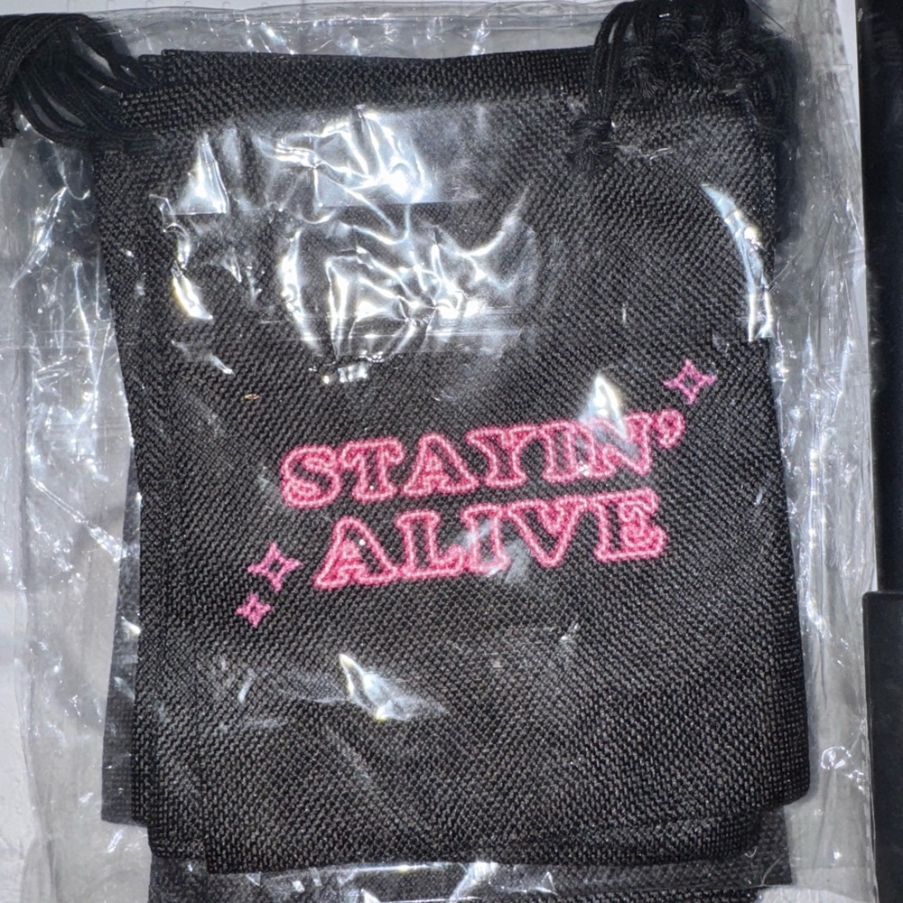 Black Drawstring Bag with Pink Text